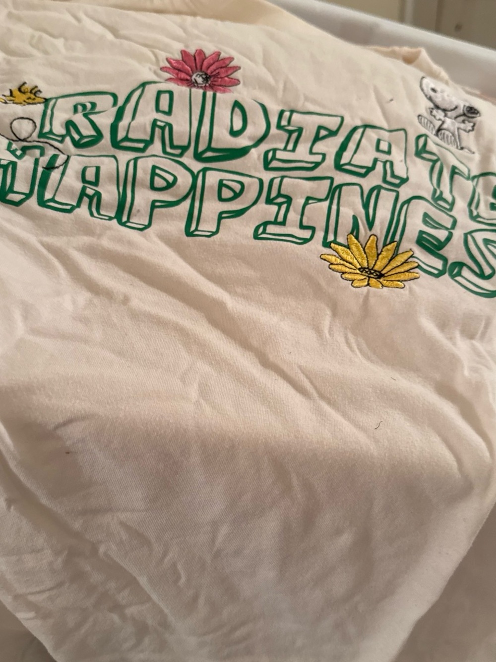 Peanuts Cream Short Sleeve Tee with Green Lettering and Floral Embroidery